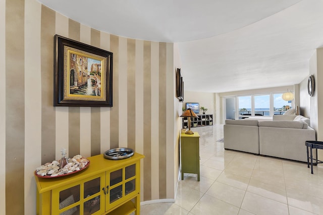 4100 Galt Ocean Dr Unit 302, Fort Lauderdale, FL 33308 - corridor featuring wallpapered walls and light tile patterned floors