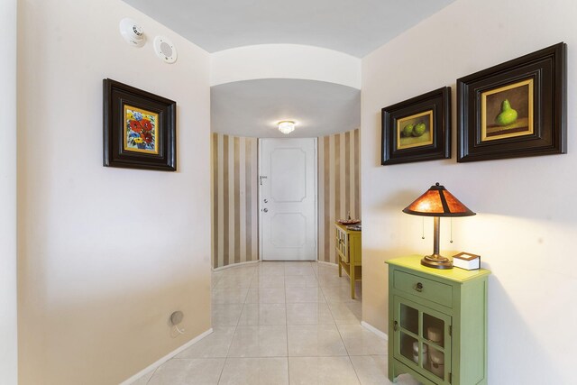 4100 Galt Ocean Dr Unit 302, Fort Lauderdale, FL 33308 - corridor with baseboards and light tile patterned floors