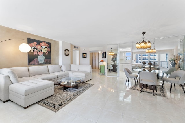 4100 Galt Ocean Dr Unit 302, Fort Lauderdale, FL 33308 - living room with a chandelier and light tile patterned floors