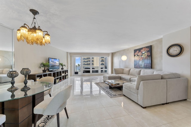 4100 Galt Ocean Dr Unit 302, Fort Lauderdale, FL 33308 - living room with a chandelier and light tile patterned flooring