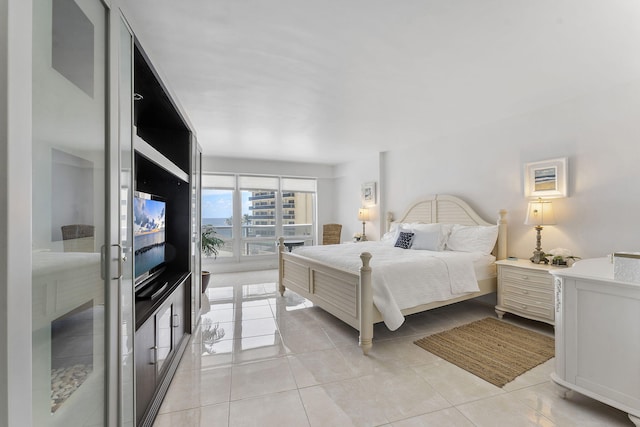 4100 Galt Ocean Dr Unit 302, Fort Lauderdale, FL 33308 - bedroom with light tile patterned floors and access to exterior