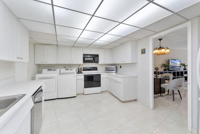4100 Galt Ocean Dr Unit 302, Fort Lauderdale, FL 33308 - kitchen with electric stove, black microwave, washer and dryer, dishwasher, and light countertops