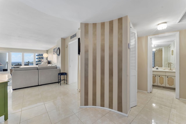 4100 Galt Ocean Dr Unit 302, Fort Lauderdale, FL 33308 - hall featuring light tile patterned flooring and a sink