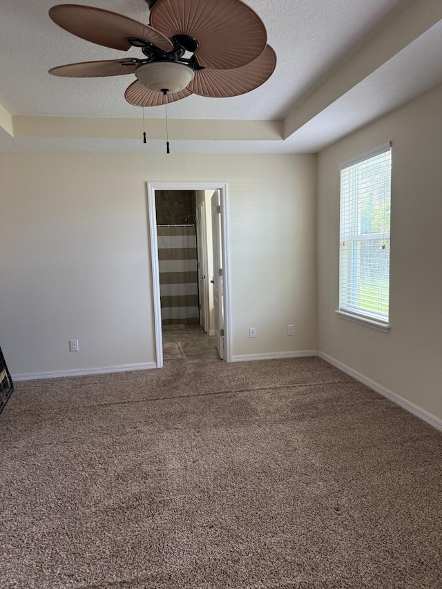 2313 SW Neal Rd, Port Saint Lucie, FL 34953 - carpeted spare room with a ceiling fan and a textured ceiling
