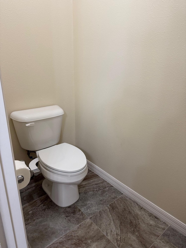 2313 SW Neal Rd, Port Saint Lucie, FL 34953 - bathroom featuring toilet and baseboards
