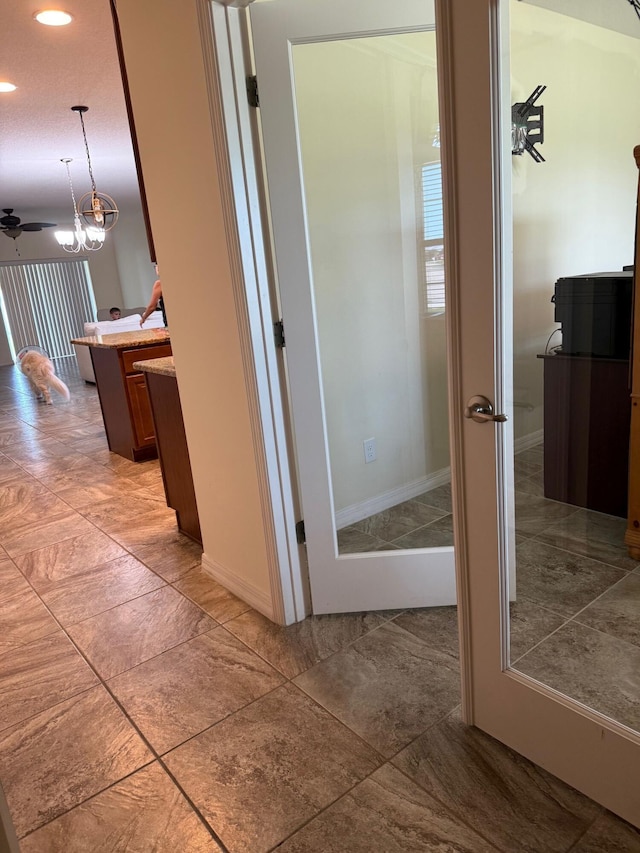 2313 SW Neal Rd, Port Saint Lucie, FL 34953 - corridor with recessed lighting and a chandelier