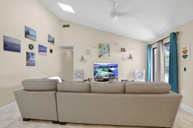 9927 Boca Gardens Trl Unit A, Boca Raton, FL 33496 - living area with lofted ceiling, light tile patterned flooring, and a textured ceiling