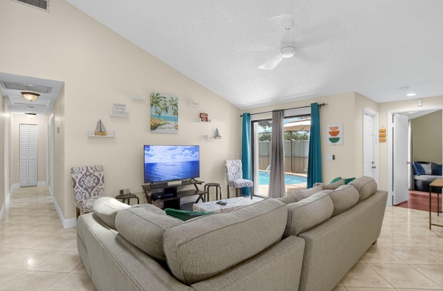 9927 Boca Gardens Trl Unit A, Boca Raton, FL 33496 - living area with light tile patterned flooring, a ceiling fan, a textured ceiling, and lofted ceiling