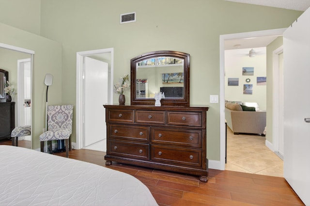 9927 Boca Gardens Trl Unit A, Boca Raton, FL 33496 - bedroom with dark wood-type flooring and high vaulted ceiling