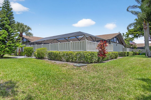 9927 Boca Gardens Trl Unit A, Boca Raton, FL 33496 - rear view of property featuring a lawn and a lanai