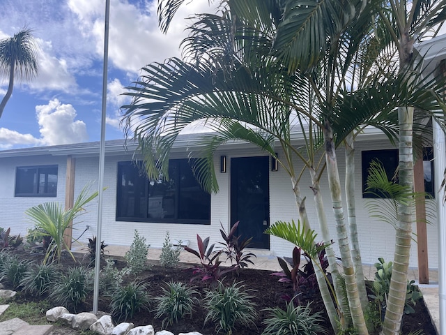 3914 Holly Dr, Palm Beach Gardens, FL 33410 - view of front of home featuring brick siding