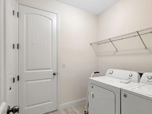 774 SE Ablett Ln, Port Saint Lucie, FL 34984 - laundry area featuring washing machine and dryer and baseboards