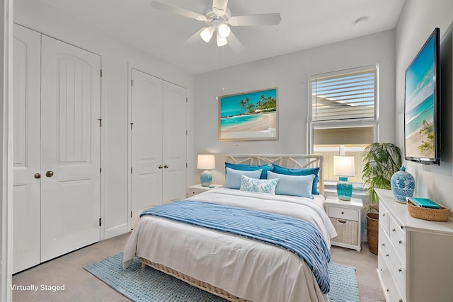 774 SE Ablett Ln, Port Saint Lucie, FL 34984 - bedroom featuring light colored carpet, a ceiling fan, and multiple closets