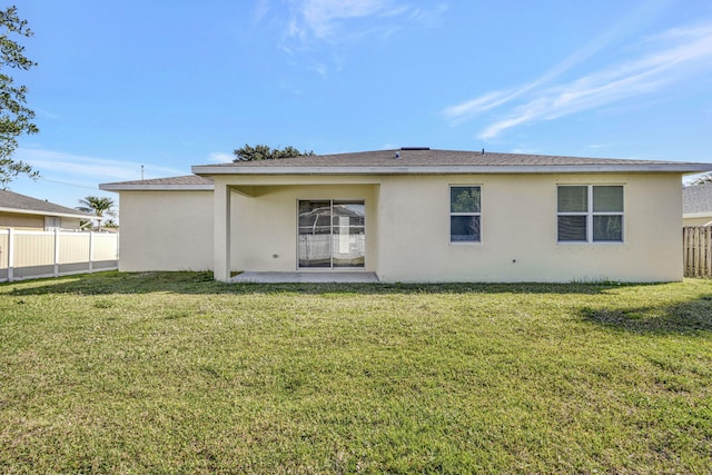 774 SE Ablett Ln, Port Saint Lucie, FL 34984 - back of property featuring stucco siding and a patio