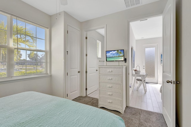 774 SE Ablett Ln, Port Saint Lucie, FL 34984 - carpeted bedroom with multiple windows