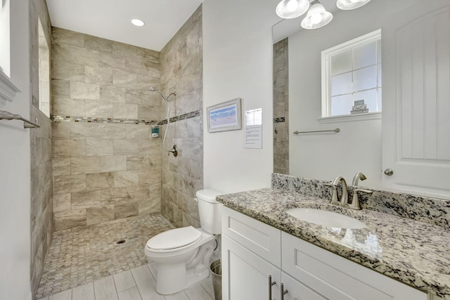 774 SE Ablett Ln, Port Saint Lucie, FL 34984 - full bath featuring vanity, a tile shower, and recessed lighting