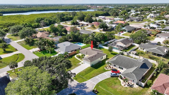 774 SE Ablett Ln, Port Saint Lucie, FL 34984 - aerial overview of property's location featuring a nearby body of water and nearby suburban area