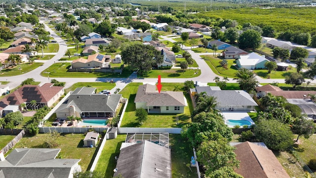 774 SE Ablett Ln, Port Saint Lucie, FL 34984 - aerial perspective of suburban area with a pool area