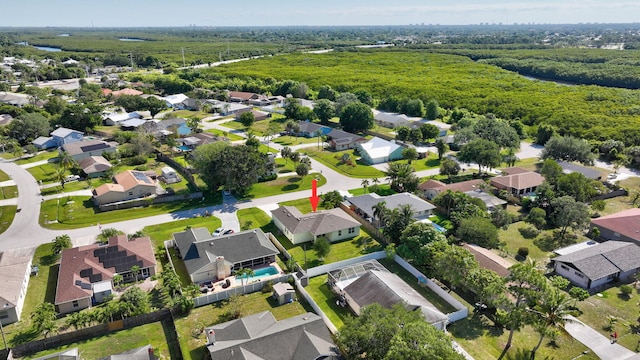 774 SE Ablett Ln, Port Saint Lucie, FL 34984 - aerial view of property's location with nearby suburban area and a heavily wooded area