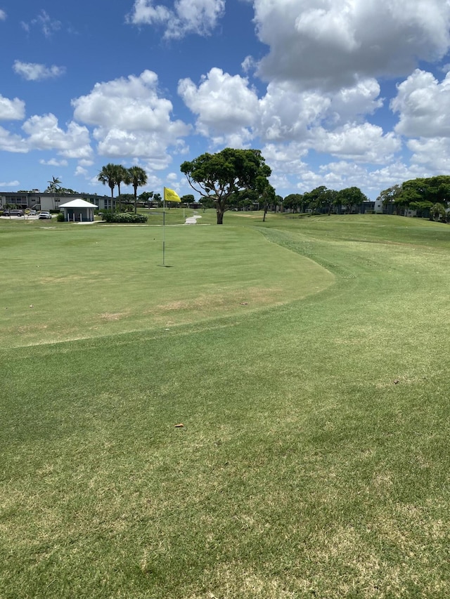 74 Normandy Unit B, Delray Beach, FL 33484 - view of home's community featuring golf course view, a yard, and a putting green