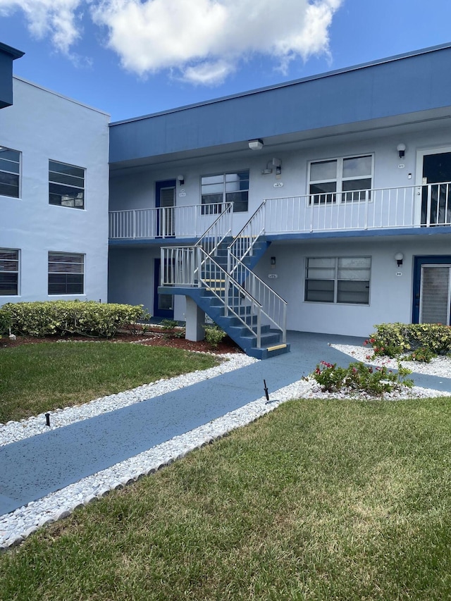 74 Normandy Unit B, Delray Beach, FL 33484 - view of property featuring stairs