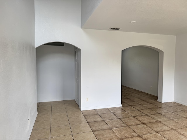 1965 SW Bellevue Ave, Port Saint Lucie, FL 34953 - spare room featuring arched walkways