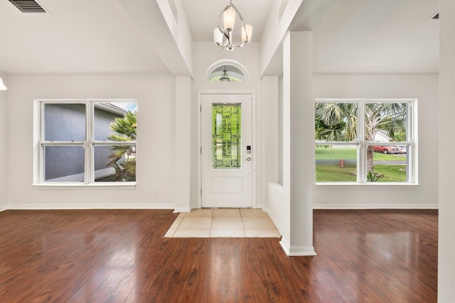 1901 SW Diamond St, Port Saint Lucie, FL 34953 - entrance foyer featuring wood finished floors and baseboards