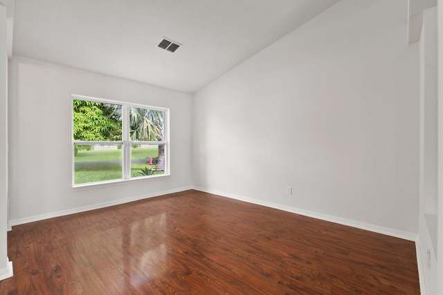 1901 SW Diamond St, Port Saint Lucie, FL 34953 - empty room with vaulted ceiling and dark wood-style flooring