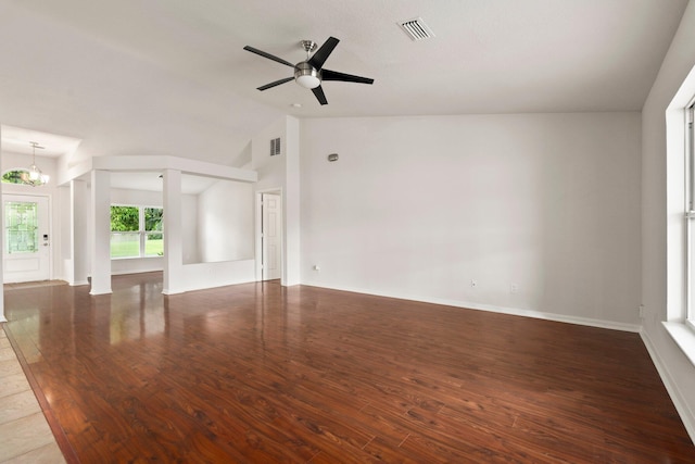 1901 SW Diamond St, Port Saint Lucie, FL 34953 - unfurnished living room with a chandelier, wood finished floors, ceiling fan, and high vaulted ceiling