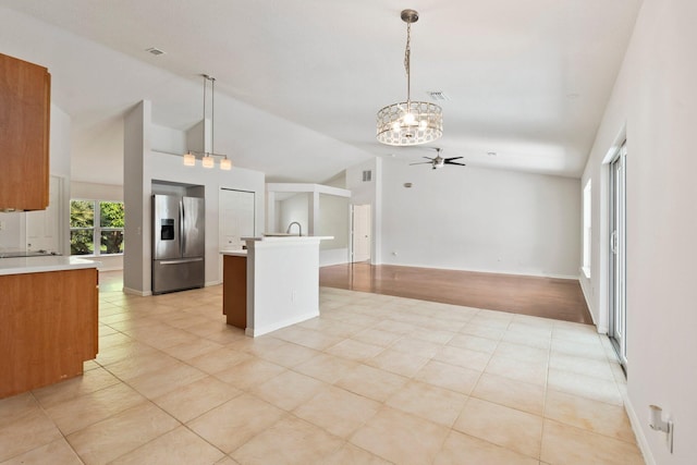 1901 SW Diamond St, Port Saint Lucie, FL 34953 - kitchen featuring stainless steel fridge with ice dispenser, ceiling fan, a chandelier, light countertops, and open floor plan