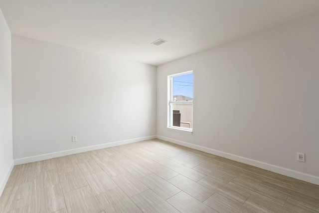 1901 SW Diamond St, Port Saint Lucie, FL 34953 - unfurnished room featuring baseboards and light wood-style flooring