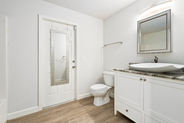 1901 SW Diamond St, Port Saint Lucie, FL 34953 - bathroom featuring wood finished floors and vanity
