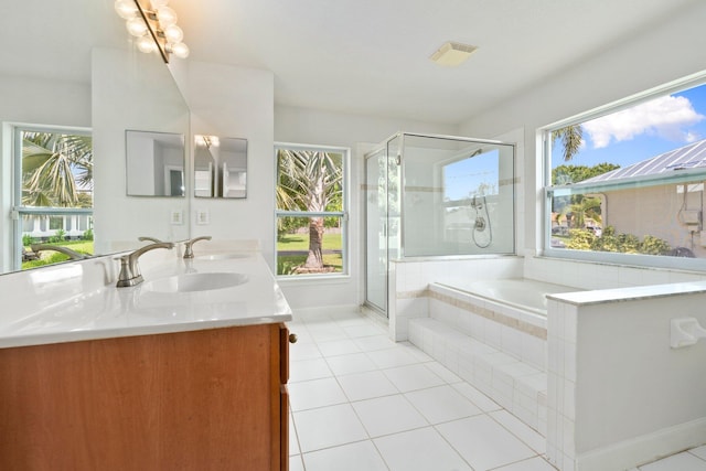 1901 SW Diamond St, Port Saint Lucie, FL 34953 - bathroom with tile patterned flooring, double vanity, a shower stall, and a bath