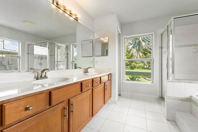 1901 SW Diamond St, Port Saint Lucie, FL 34953 - bathroom featuring healthy amount of natural light, a shower stall, and double vanity