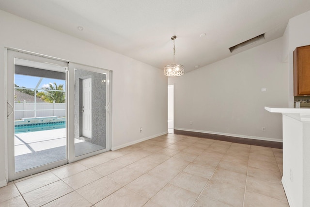 1901 SW Diamond St, Port Saint Lucie, FL 34953 - empty room with a chandelier and light tile patterned floors