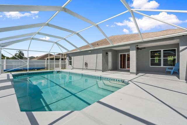 1901 SW Diamond St, Port Saint Lucie, FL 34953 - view of swimming pool with a patio area, a ceiling fan, and glass enclosure