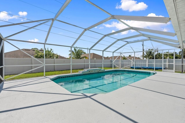 1901 SW Diamond St, Port Saint Lucie, FL 34953 - view of pool with a patio area, a fenced backyard, and a lanai