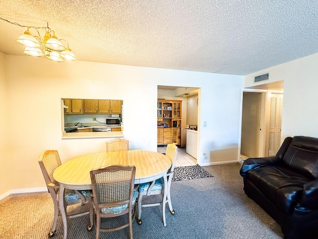 3658 Alder Dr Unit D1, West Palm Beach, FL 33417 - dining room featuring light colored carpet and a textured ceiling