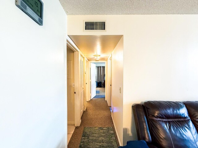 3658 Alder Dr Unit D1, West Palm Beach, FL 33417 - hall with a textured ceiling and carpet floors