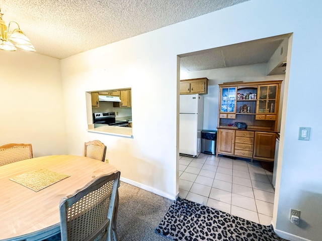 3658 Alder Dr Unit D1, West Palm Beach, FL 33417 - dining area with a textured ceiling and light tile patterned floors