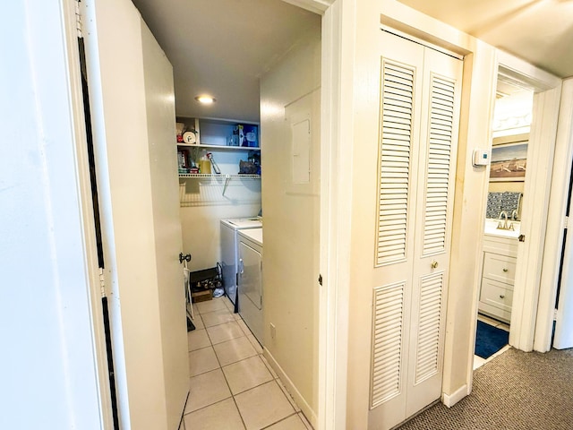 3658 Alder Dr Unit D1, West Palm Beach, FL 33417 - corridor with washing machine and clothes dryer, light tile patterned floors, and recessed lighting