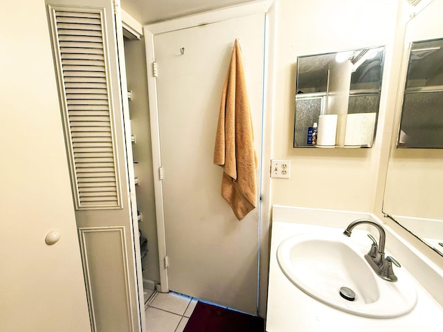 3658 Alder Dr Unit D1, West Palm Beach, FL 33417 - bathroom with tile patterned floors, vanity, and a closet