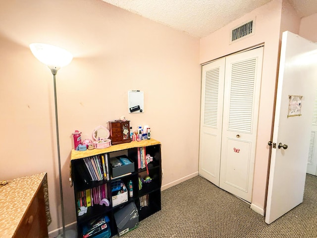 3658 Alder Dr Unit D1, West Palm Beach, FL 33417 - rec room featuring carpet and a textured ceiling