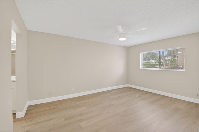 5574 Witney Dr Unit 104, Delray Beach, FL 33484 - unfurnished room with light wood-style floors and a ceiling fan