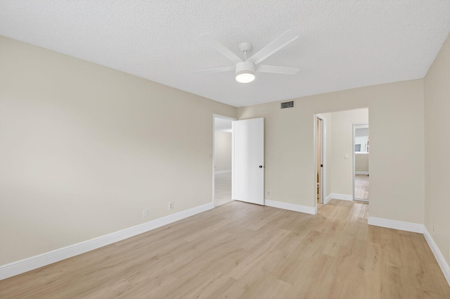 5574 Witney Dr Unit 104, Delray Beach, FL 33484 - empty room with a ceiling fan, light wood-type flooring, and a textured ceiling