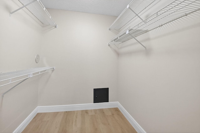 5574 Witney Dr Unit 104, Delray Beach, FL 33484 - spacious closet featuring wood finished floors