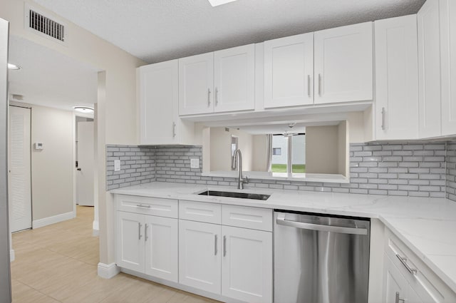 5574 Witney Dr Unit 104, Delray Beach, FL 33484 - kitchen featuring dishwasher, white cabinetry, and tasteful backsplash