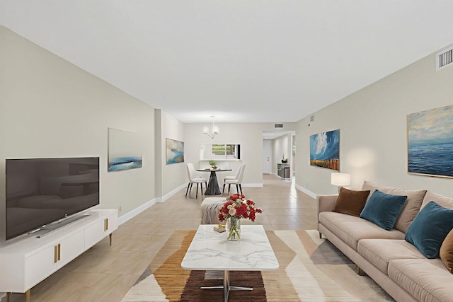 5574 Witney Dr Unit 104, Delray Beach, FL 33484 - living room with light tile patterned floors and a chandelier