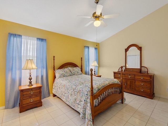 374 NW Sherry Ln, Port Saint Lucie, FL 34986 - bedroom with multiple windows, lofted ceiling, a ceiling fan, and light tile patterned floors