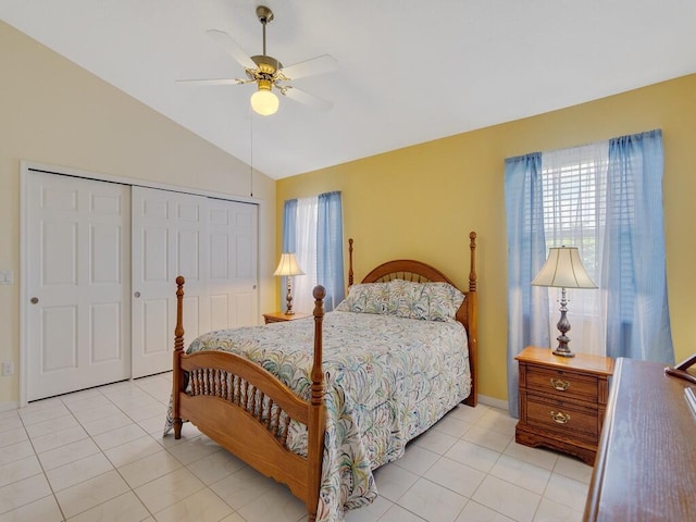 374 NW Sherry Ln, Port Saint Lucie, FL 34986 - bedroom with vaulted ceiling, a closet, light tile patterned floors, and a ceiling fan